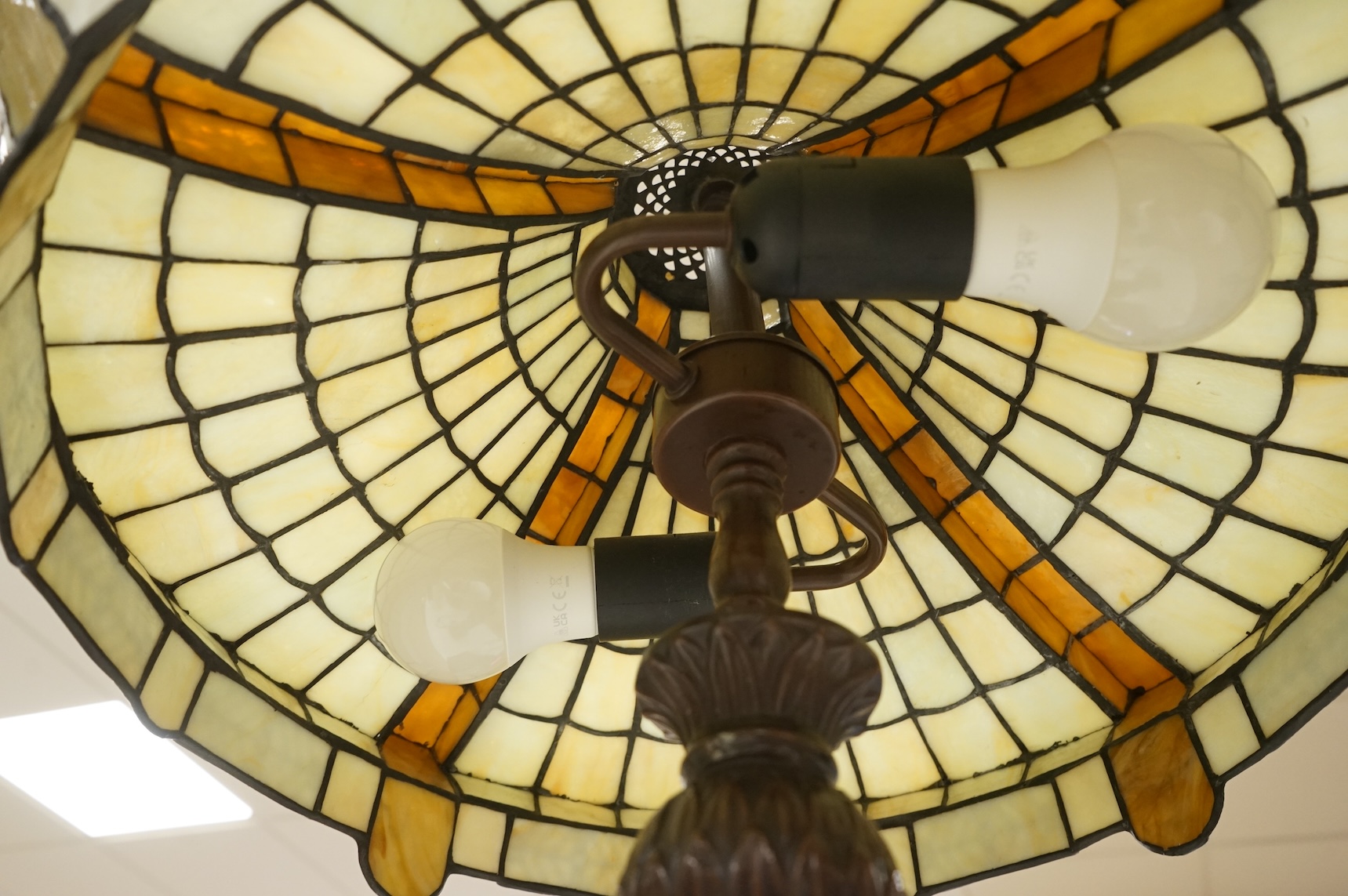 A bronze-effect Tiffany style leaded table lamp, 67cm high